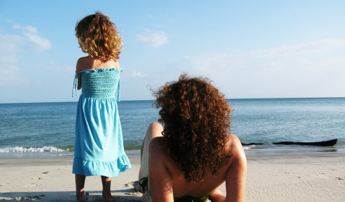 Leigh Shulman relaxing on the beach with her daughter