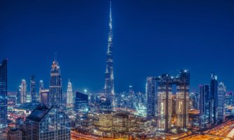 The towering and modern skyline of Dubai at night with the Burj Khalifa