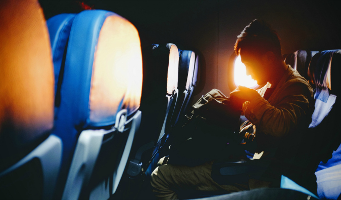 A man sitting on a plane