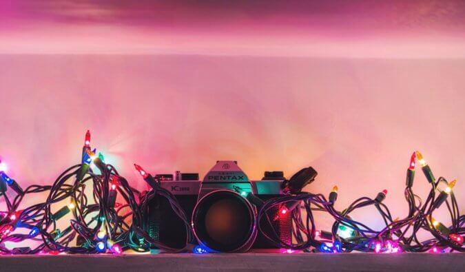 a camera covered in Christmas lights