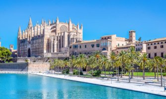 A huge, historic Cathedral in Palma de Mallorca in Spain during the summer